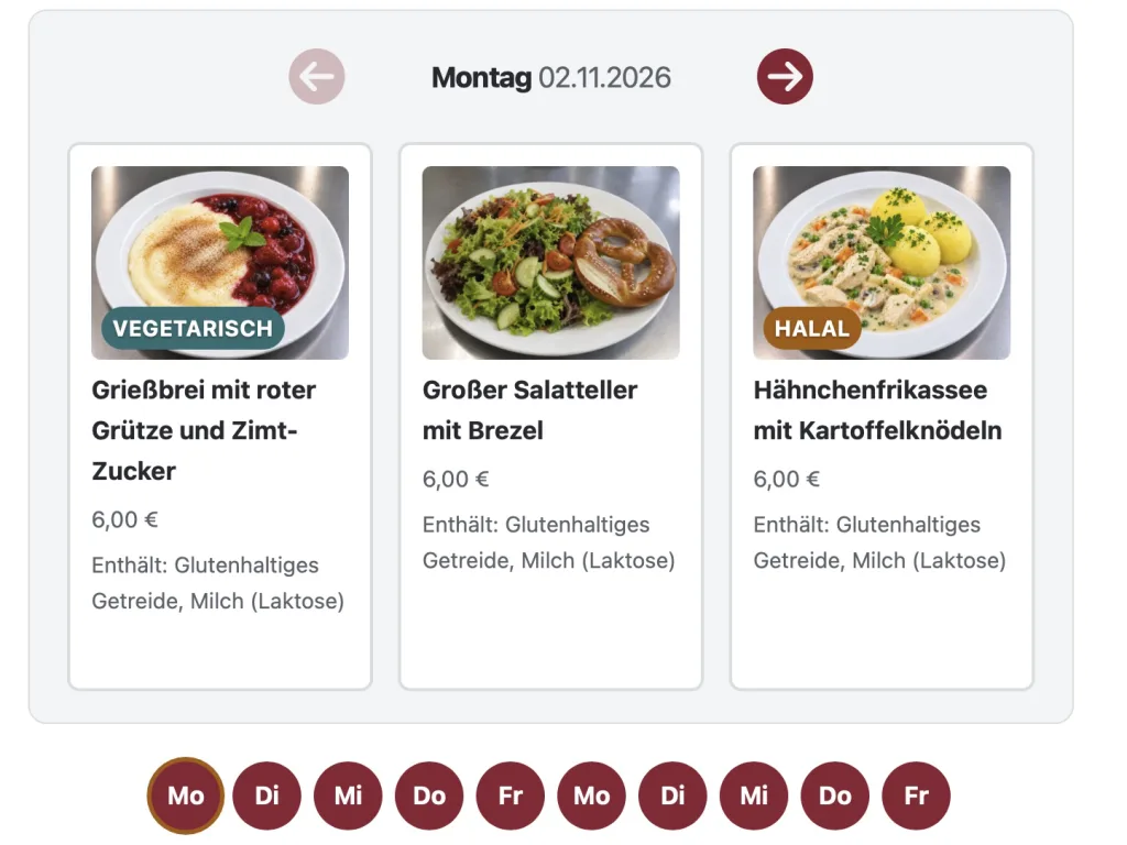 Screenshot der digitalen Bestelloberfläche für das Mittagessen an der Adolf-Reichwein-Schule. Oben wird der Montag, 2. November 2026, angezeigt. Darunter sind drei Gerichte mit Fotos und Preisen von jeweils 6,00 Euro abgebildet: vegetarischer Grießbrei mit roter Grütze und Zimtzucker, ein großer Salatteller mit Brezel sowie Hähnchenfrikassee mit Kartoffelknödeln. Die Gerichte sind mit Hinweisen wie „Vegetarisch“ und „Halal“ gekennzeichnet. Unter den Speiseangeboten befindet sich eine Auswahl der Wochentage, über die weitere Tagesmenüs aufgerufen werden können.